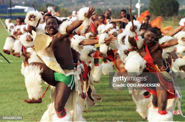 Traditional Swazi soldiers entertain HRH Prince Charles with dance at the Ludzindzini Royal palace outside Mbabane, 29 October. Prince Charles is on...