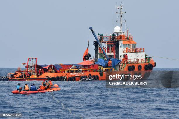 The wheels of the ill-fated Lion Air flight JT 610 are recovered from the sea during search operations north of Karawang on November 2, 2018. -...