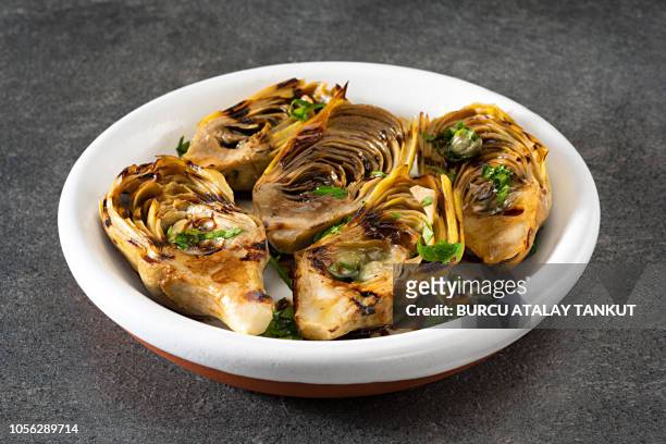 artichokes with balsamic sauce - artichoke stock pictures, royalty-free photos & images