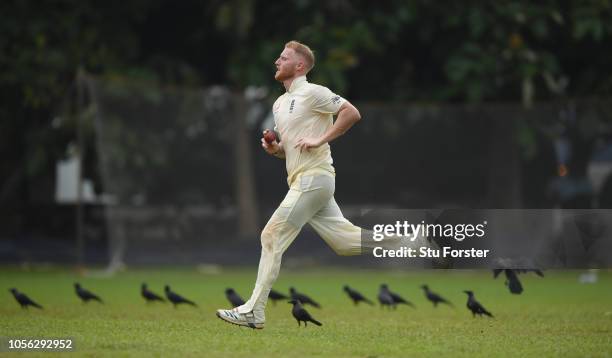 England bowler Ben Stokes runs in to bowl amongst the on field crows during the Tour match between Sri Lanka Board President's XI and England at...