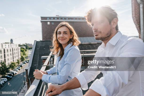 business people standing on balcony - duisburg stock pictures, royalty-free photos & images