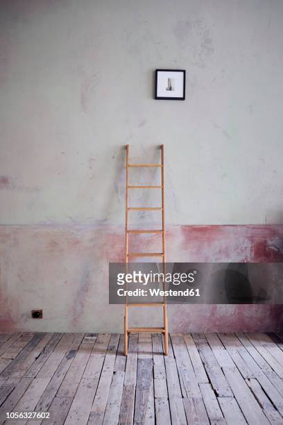 ladder and picture in an unrenovated room in a loft - ladder leaning stock pictures, royalty-free photos & images