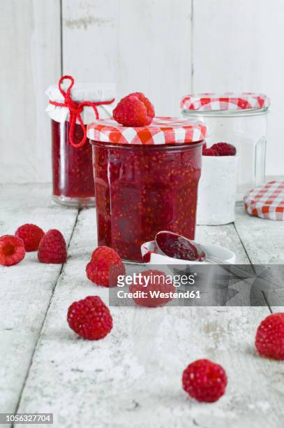 jars of raspberry jam and raspberries - raspberry jam stock pictures, royalty-free photos & images