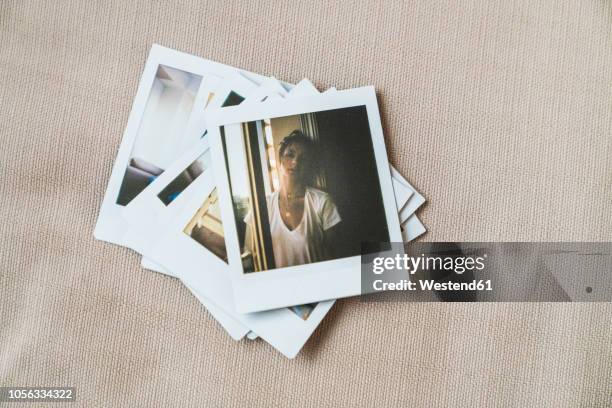 stack of instant photos of young woman - imagem imagens e fotografias de stock