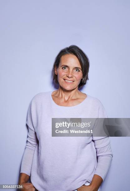 portrait of smiling mature woman - woman waist up stock-fotos und bilder