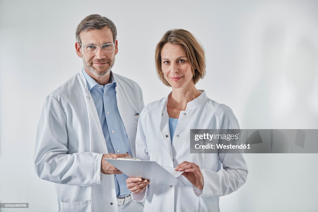 Portrait of doctors with anamnesis questionnaire