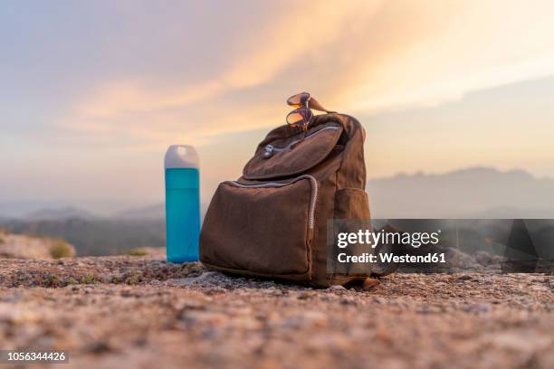 backpack in the mountains - school bag stock-fotos und bilder