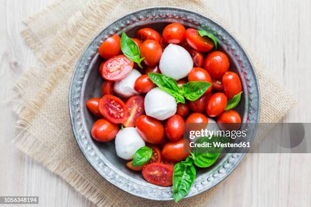 italian food, caprese, mozzarella and tomatoes and basil - mozzarella stock pictures, royalty-free photos & images