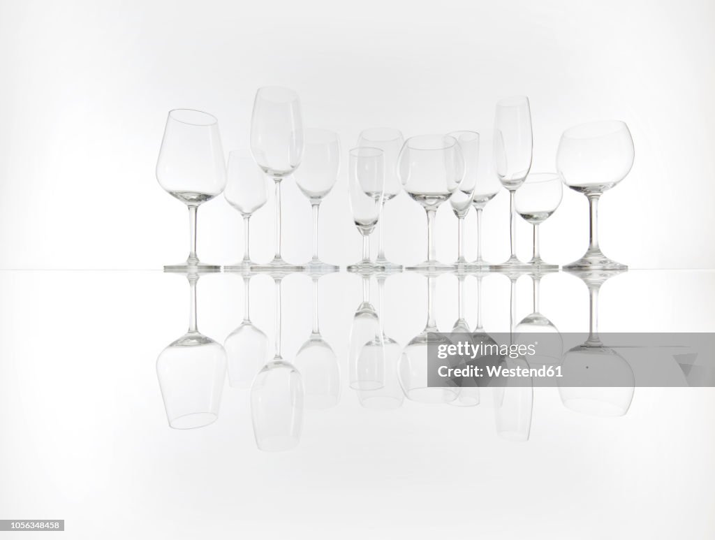 Various empty glasses in a row
