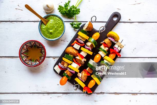 vegetarian grill skewers, tomato, yellow and green zucchini, tofu, feta, onion and champignon, argentinian chimichurri - skewer stock pictures, royalty-free photos & images