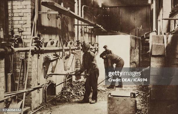Workers stoking the boiler fires at the Rhondda Valley Colliery, maintaining the safety of the coal mine during the strike, Wales, United Kingdom,...