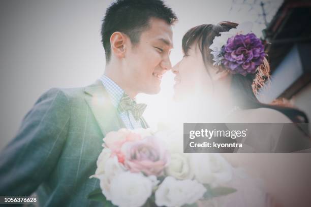 bride and groom - wedding ceremony kiss stock pictures, royalty-free photos & images