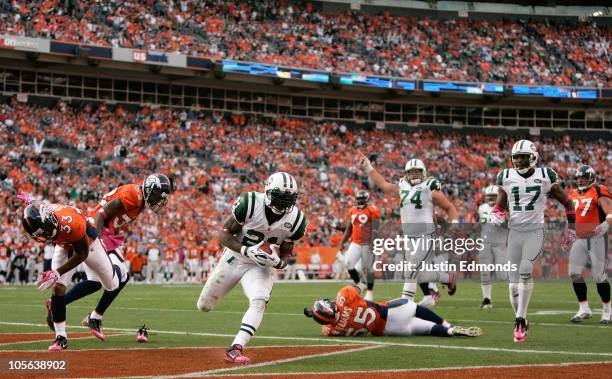 Running back LaDainian Tomlinson the New York Jets strides into the endzone for a touchdown against the Denver Broncos at INVESCO Field at Mile High...