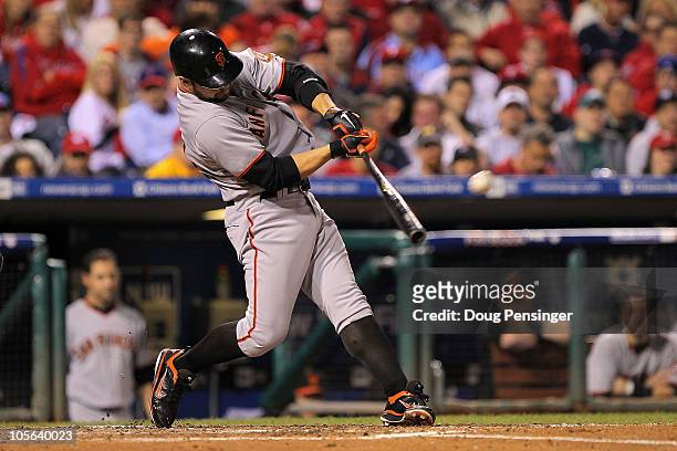 Cody Ross of the San Francisco Giants hits a solo home run in the fifth inning against the Philadelphia Phillies in Game Two of the NLCS during the...
