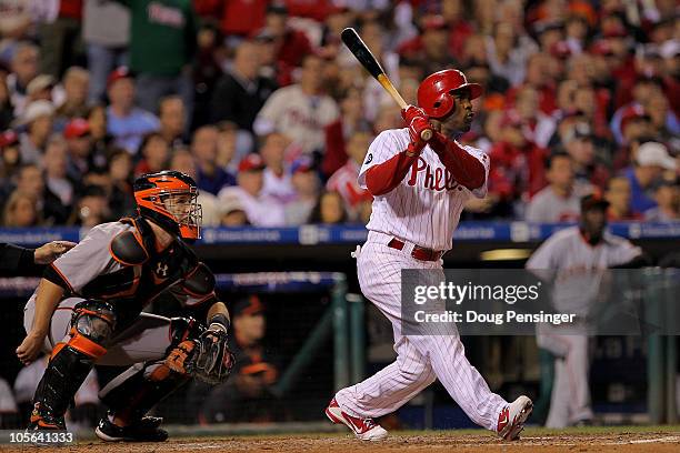 Jimmy Rollins of the Philadelphia Phillies hits a three run double to left field in the seventh inning against the San Francisco Giants in Game Two...