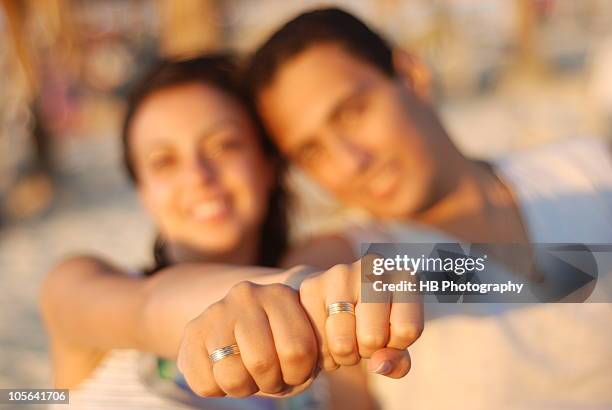 engaged couple showing their rings - woman showing ring stock pictures, royalty-free photos & images