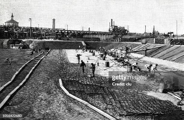 sand filter basin during construction - construction sand stock illustrations