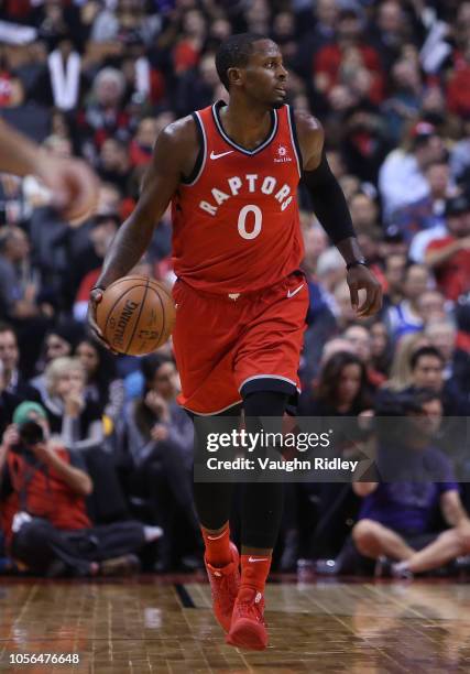Miles of the Toronto Raptors dribbles the ball during the second half of the NBA season opener against the Cleveland Cavaliers at Scotiabank Arena on...