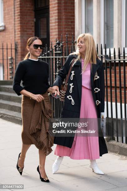 Stylist and Creative consultant Evangeline Smyrniotaki wears a Balenciaga skirt and shoes and a black sweater with Fashion stylist and consultant Ada...