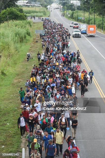 Salvadorean migrants heading in a caravan to the US, walk alongside the route, between Ciudad Hidalgo and Tapachula in Mexico on November 02, 2018. -...