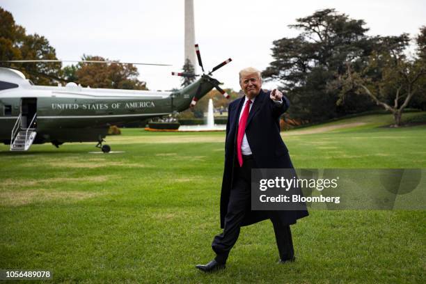 President Donald Trump gestures while walking towards Marine One to depart for West Virginia on the South Lawn of the White House in Washington,...