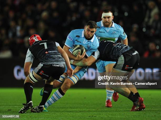 Glasgow Warriors' Adam Ashe is tackled by Ospreys' Rhodri Jones during the Guinness Pro14 Round match between Ospreys and Glasgow Warriors at Liberty...