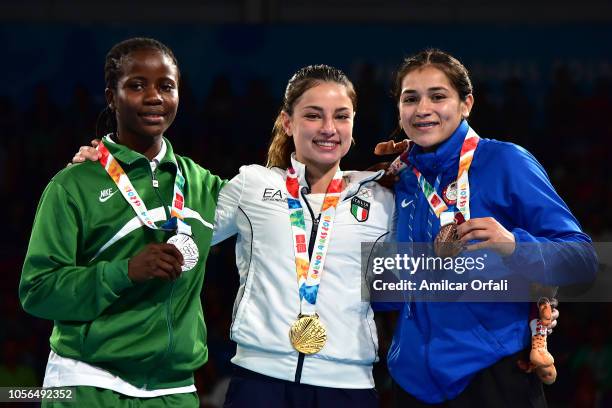 Adijat Gbadamosi of Nigeria, Martina La Piana of Italy and Heaven Destiny Garcia of United States pose in the podium of Women's Fly during day 12 of...