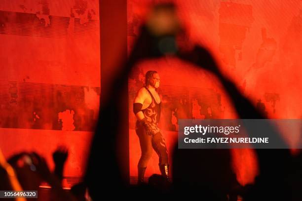 Kane, of The Brothers of Destruction, makes his way to the ring during a tag team match as part of as part of the World Wrestling Entertainment Crown...