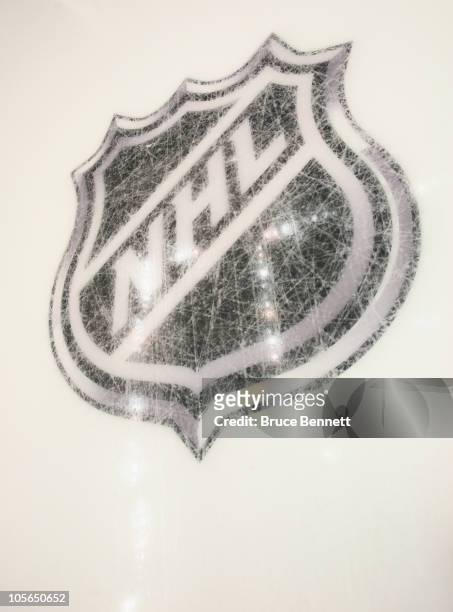 New logos are etched into the ice prior to the game between the Pittsburgh Penguins and the Philadelphia Flyers at the Consol Energy Center on...