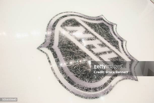 New logos are etched into the ice prior to the game between the Pittsburgh Penguins and the Philadelphia Flyers at the Consol Energy Center on...