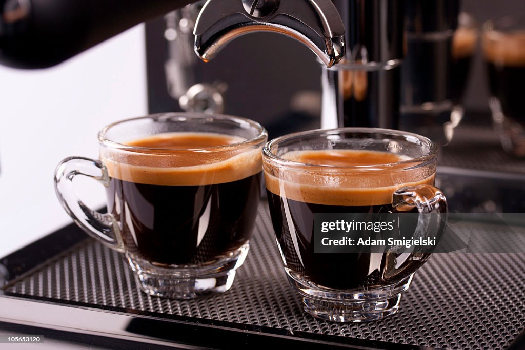 Two cups of espresso shot with crema