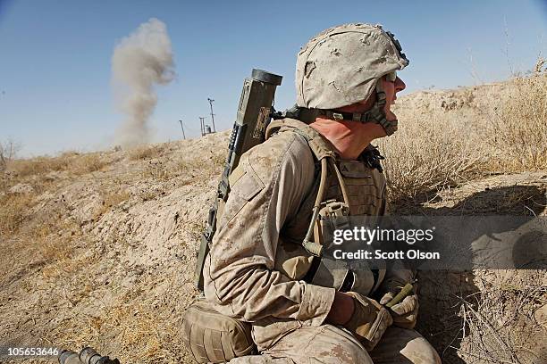 Marine LCpl. Bryant Whalen of Brookfield, WI with India Battery, 3rd Battalion, 12th Marine Regiment detonates an explosion meant to simulate an...