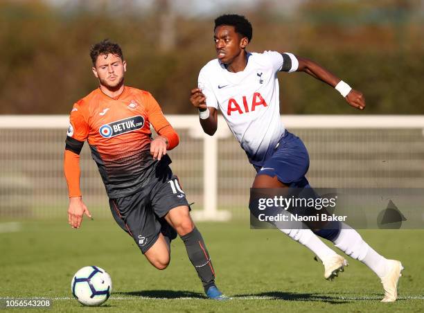 Paris Maghoma of Tottenham Hotspur in action as Keiran Evans of Swansea chases the ball during the Premier League 2 match between Tottenham Hotspur...