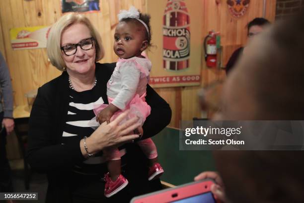 Senator Claire McCaskill greets supporters during a campaign stop at Shakespeare's Pizza on November 2, 2018 in Columbia, Missouri. McCaskill is in a...