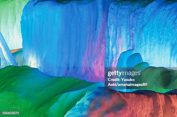 illuminated icicles at the sounkyo icefall festival. kamikawa subprefecture, hokkaido, japan - icefall stock pictures, royalty-free photos & images