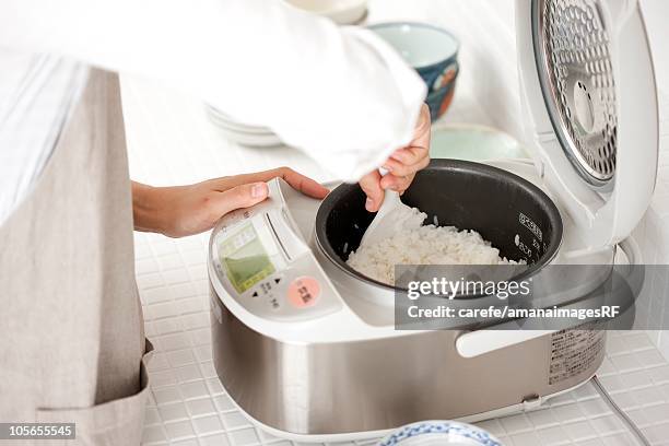 Someone Cook Rice 713 Rice Cooker Stock Photos, High-Res Pictures, and Images - Getty Images