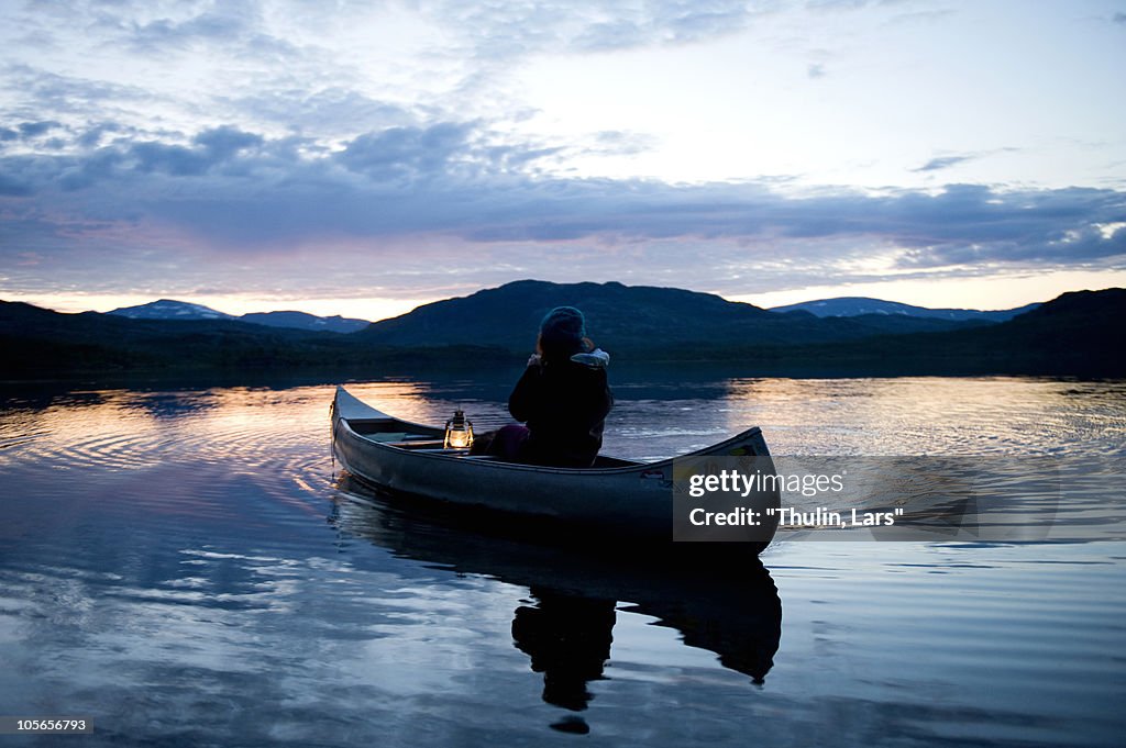 Person in boat with lantern