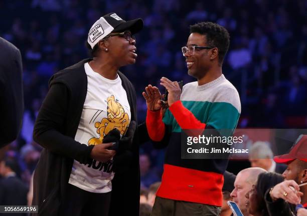 Saturday Night Live' cast member Leslie Jones and comedian Chris Rock attend a game between the New York Knicks and the Golden State Warriors at...