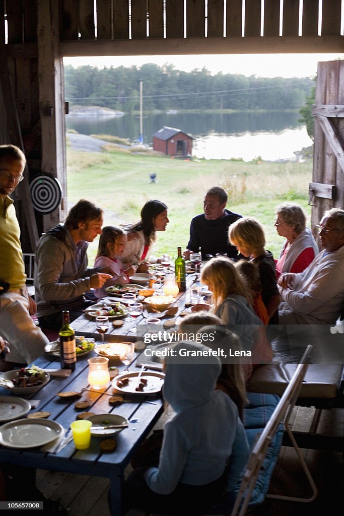Group of people having meal at party
