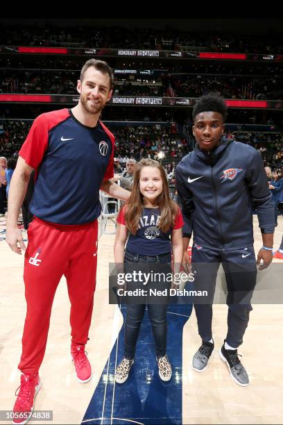 Washington Wizards forward Jason Smith and Oklahoma City Thunder guard Hamidou Diallo pose for a photo with a fan prior to the game between the...