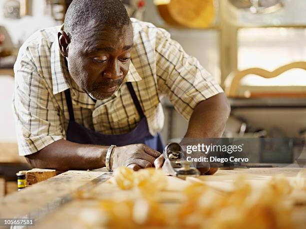 black craftsman working in workshop - carving craft activity stock pictures, royalty-free photos & images