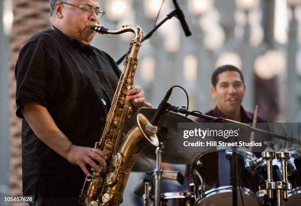 men playing in jazz band - jazz concert stock pictures, royalty-free photos & images