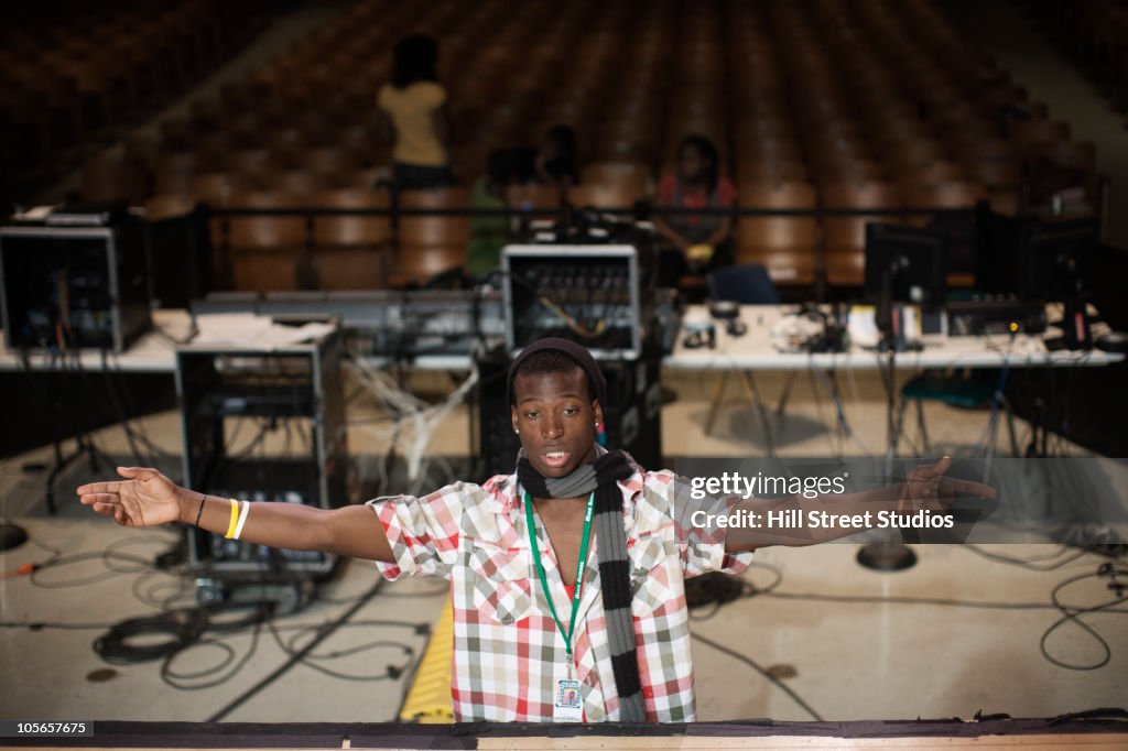 Black man directing stage production