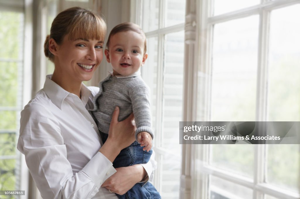 Caucasian mother holding baby