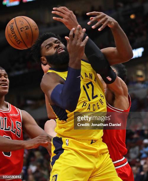 Tyreke Evans of the Indiana Pacers is fouled by Chandler Hutchison of the Chicago Bulls at the United Center on November 2, 2018 in Chicago,...