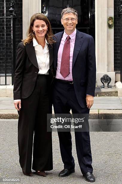 Bill Gates and his wife Melinda pose for photographs outside Number 10 Downing Street on October 18, 2010 in London, England.