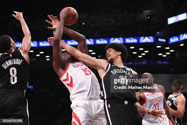 Clint Capela of the Houston Rockets fights for the ball against Jarrett Allen of the Brooklyn Nets during the game at Barclays Center on November 02,...