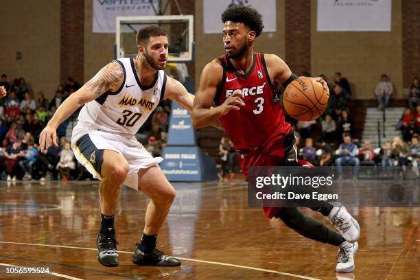 Gary Talton of the Sioux Falls Skyforce drives with the ball past Michael Orris from the Fort Wayne Mad Ants during an NBA G-League game on November...