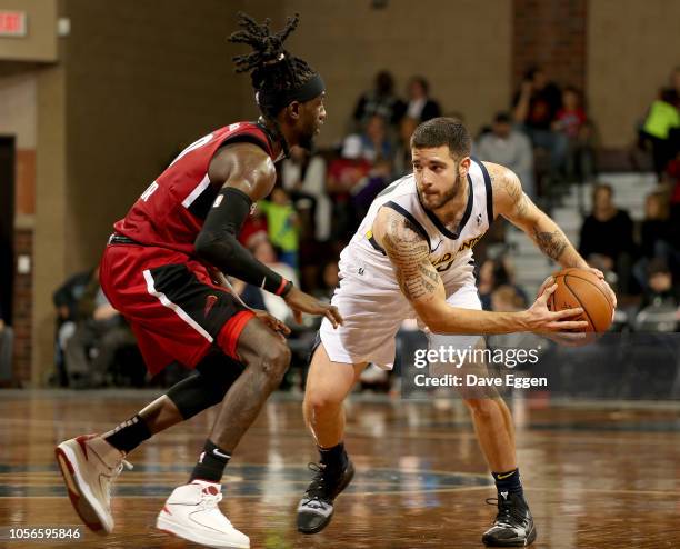 Michael Orris from the Fort Wayne Mad Ants looks to make a move against Briante Weber of the Sioux Falls Skyforce during an NBA G-League game on...