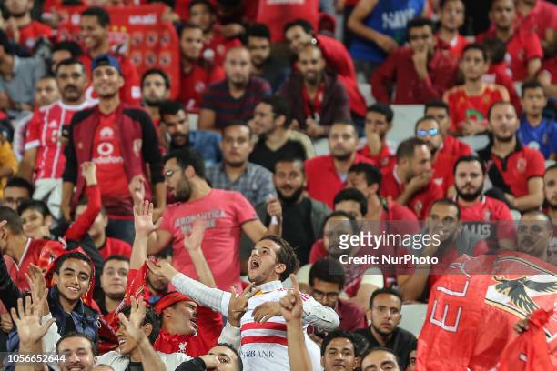 Al-Zamalek fan support Al-Ahly team during their first leg of Final African Champions League CAF match Between Al Ahly and Esperance de Tunis at Borg...